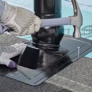 roofer nailing GAf Master Flow Pivot base flashing