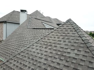 Up close of premium asphalt shingles on a steep hip roof