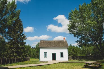 small home with damaged roof