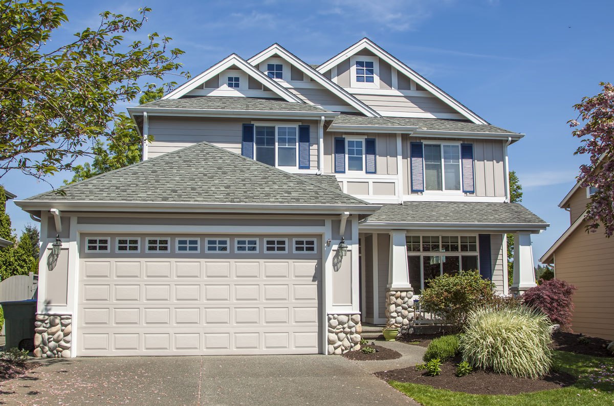 Two-story residential home with an asphalt shingle roof