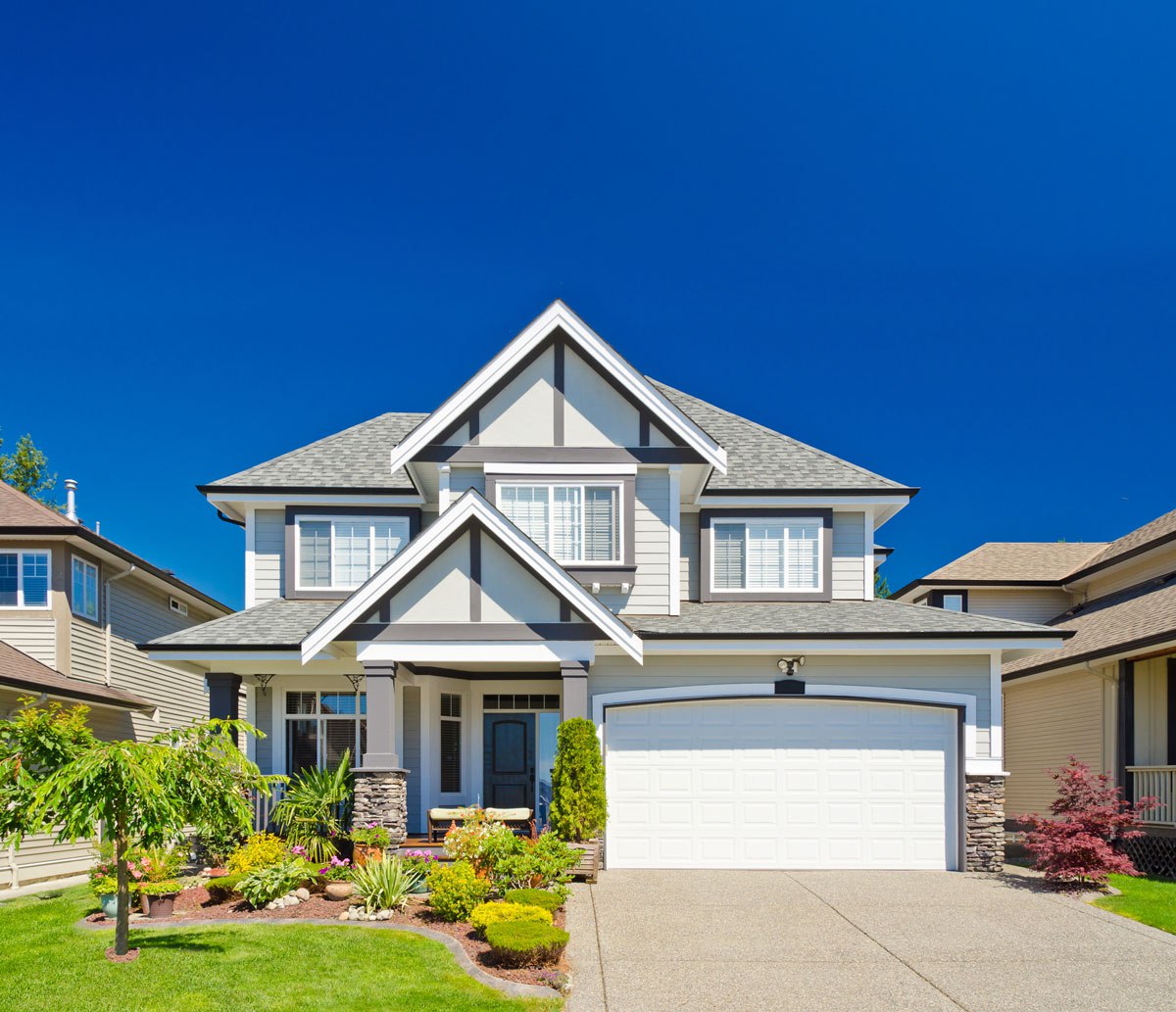 Two-story residential home with asphalt shingle roof