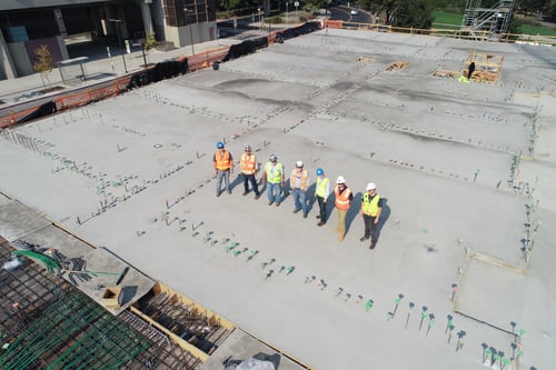 construction workers on commercial roof