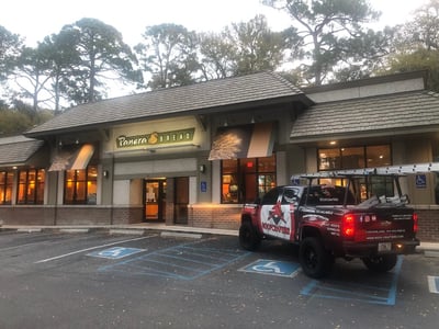 RoofCrafters Trucked parked in front of a Panera Bread with synthetic wood shake shingles 