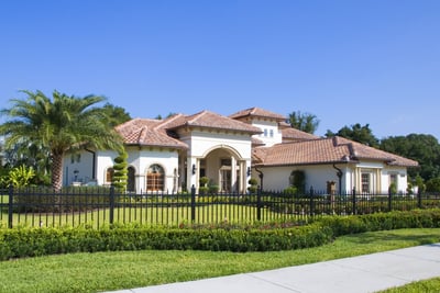 beautiful home with a clay tile roof 