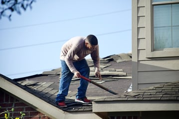 roofer fixing shingles