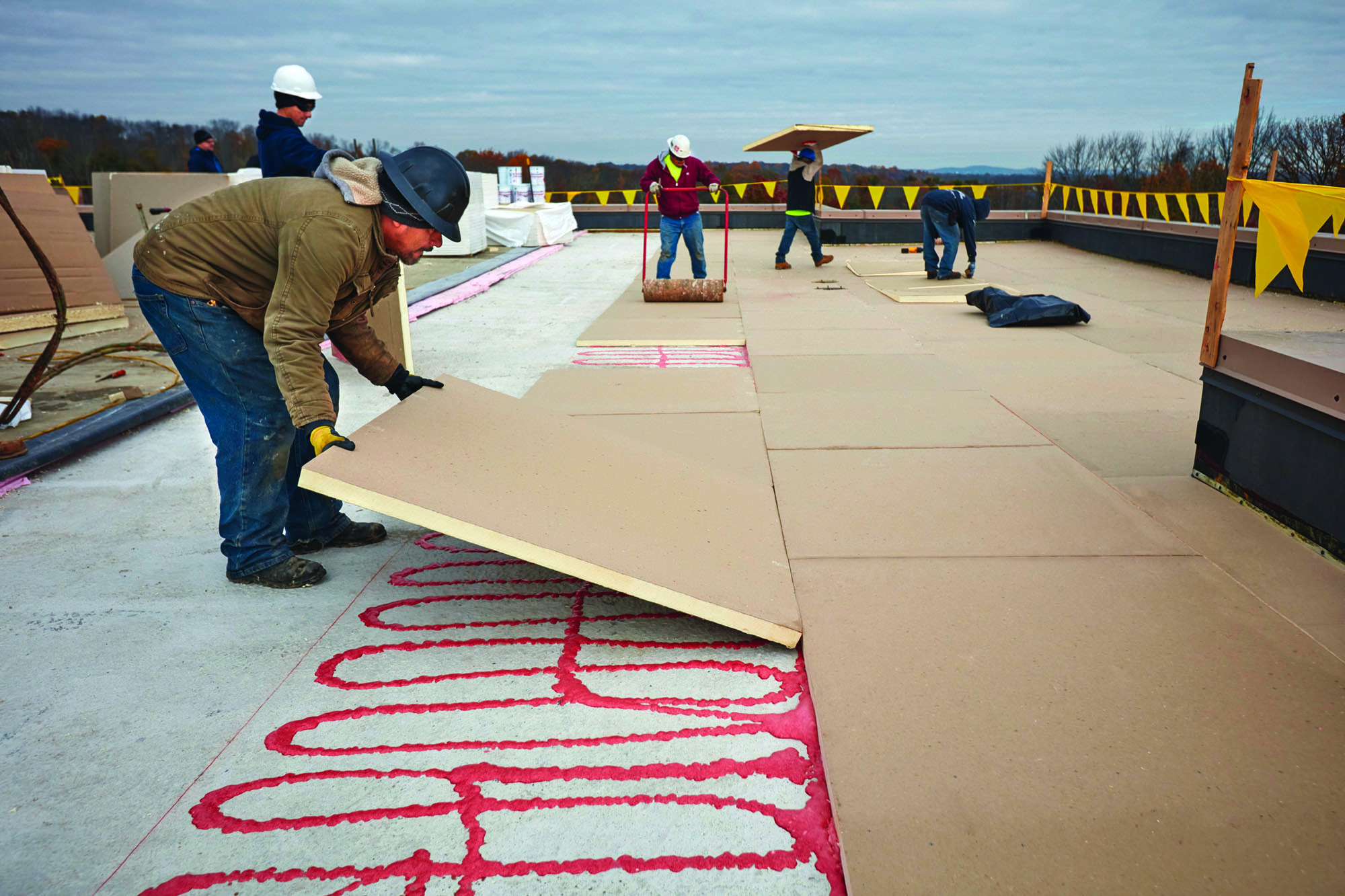 roofer installing GAF polyisocyanurate