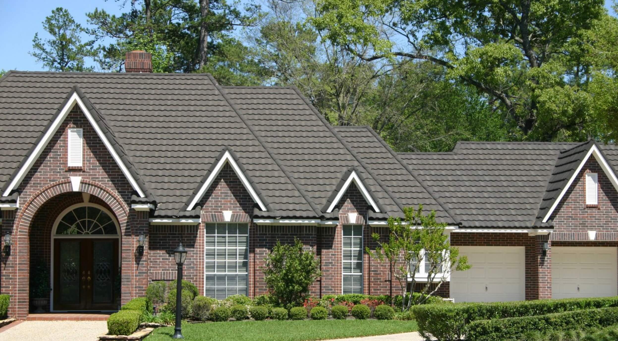 beautiful brick home with a Decra shake roof