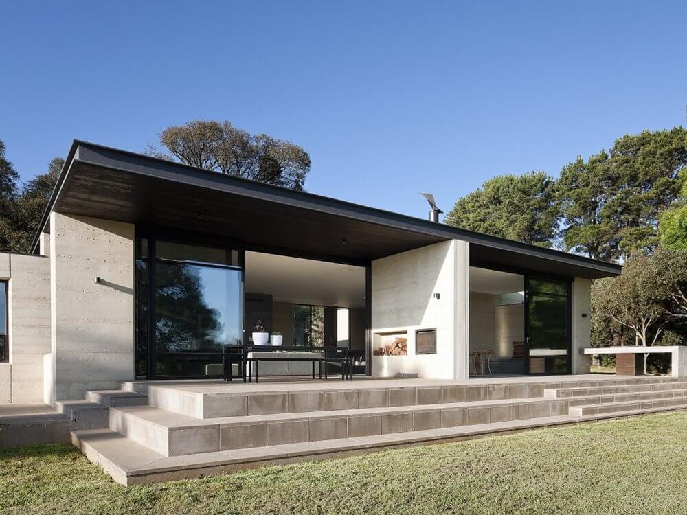 back of a modern residential home with a flat roof 