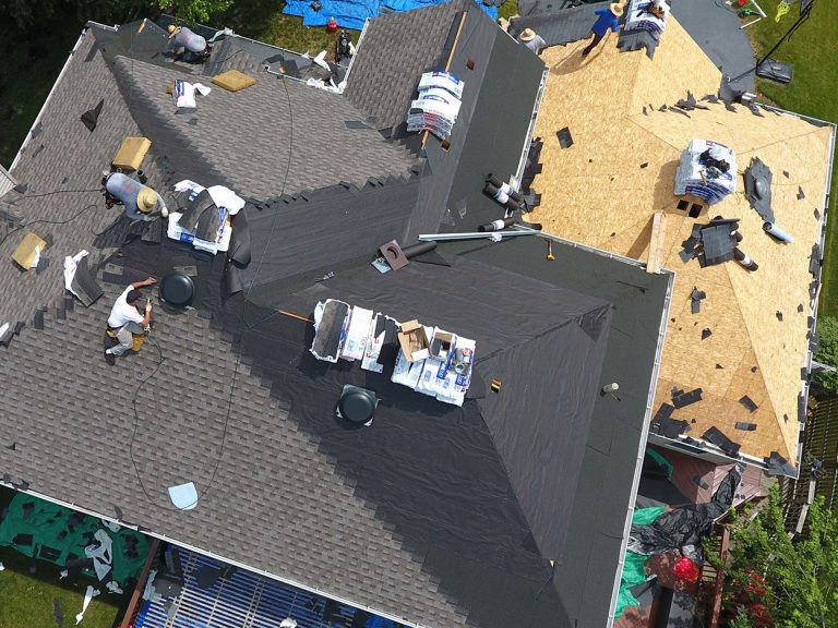 Birds eye view of an asphalt shingle roof replacement in progress