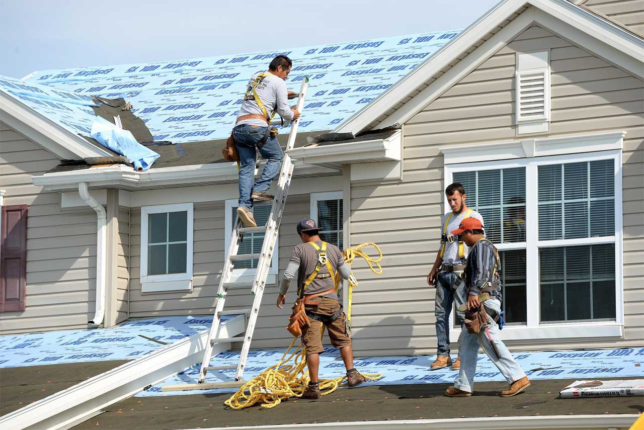 Roofing crew installing a new roof