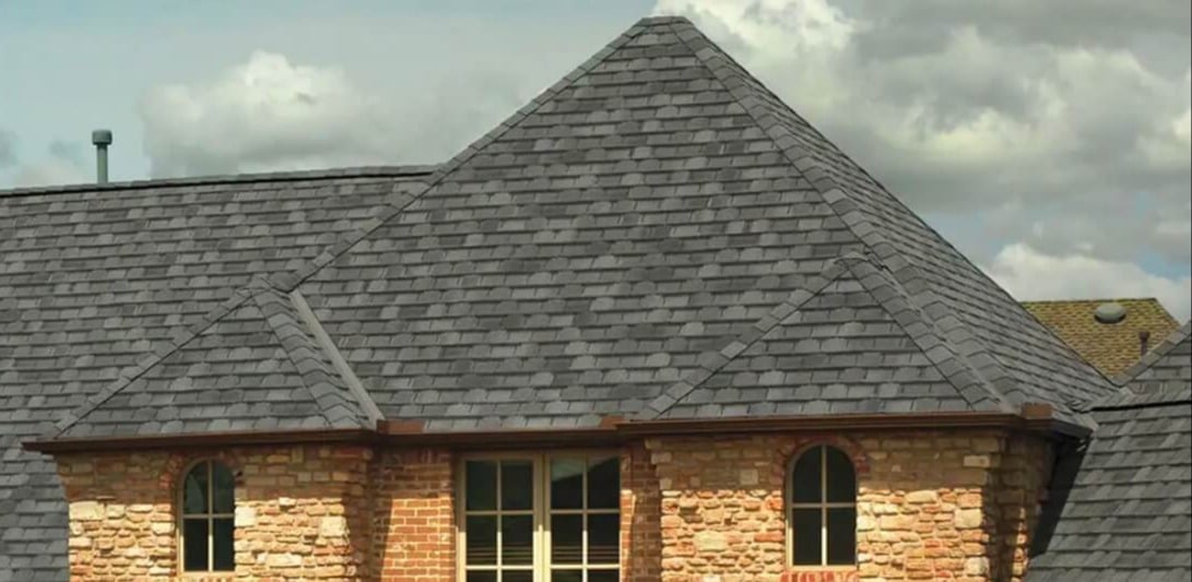 Brick home with a GAF designer shingle roof