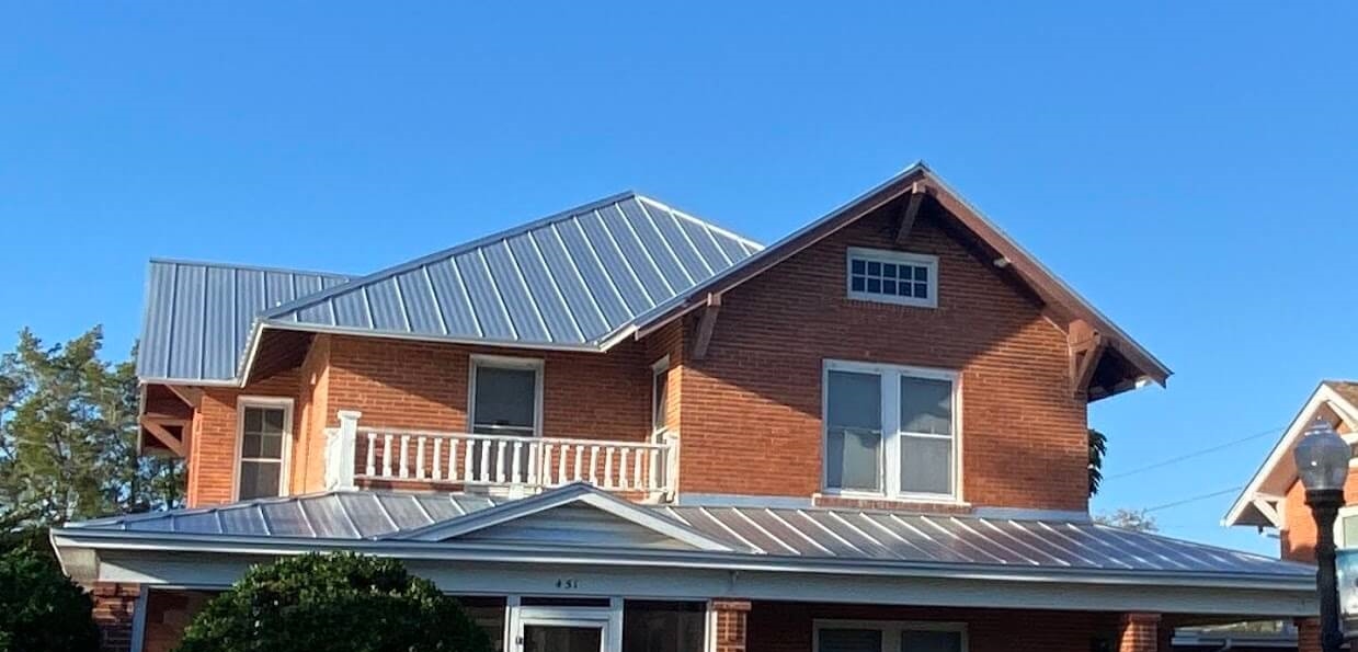 metal roof on brick home