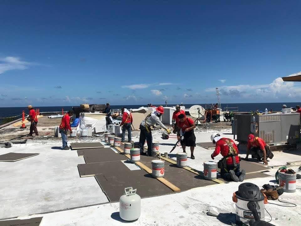 RoofCrafters crew performing a commercial roof replacement