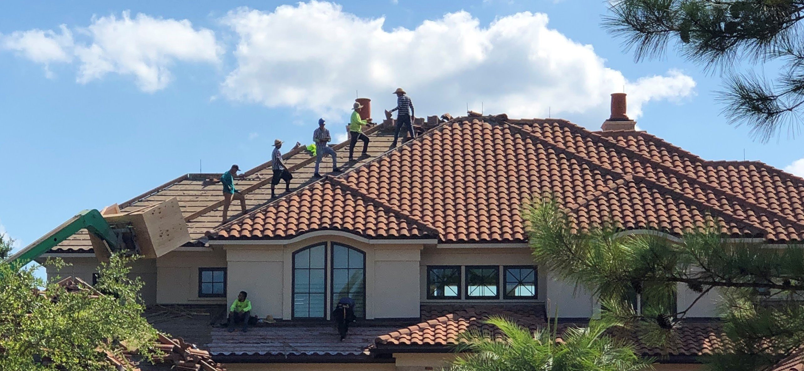Roofcrafters crew removing a tile roof 