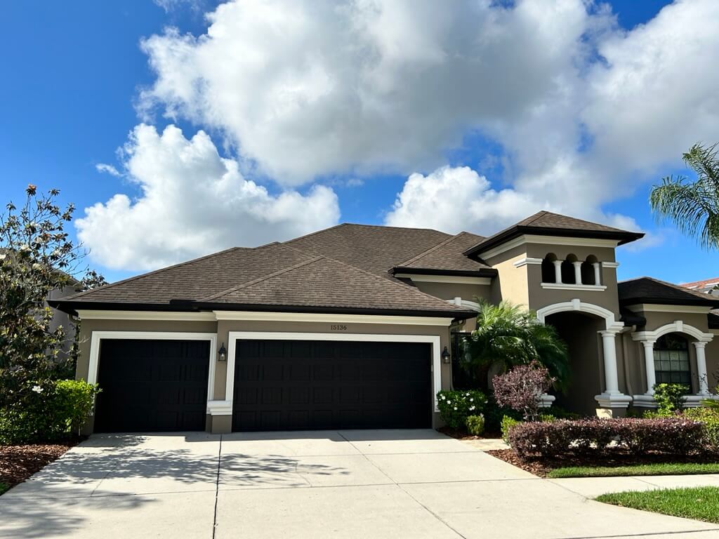 GAF Timberline HDZ weathered wood shingles on a stucco home