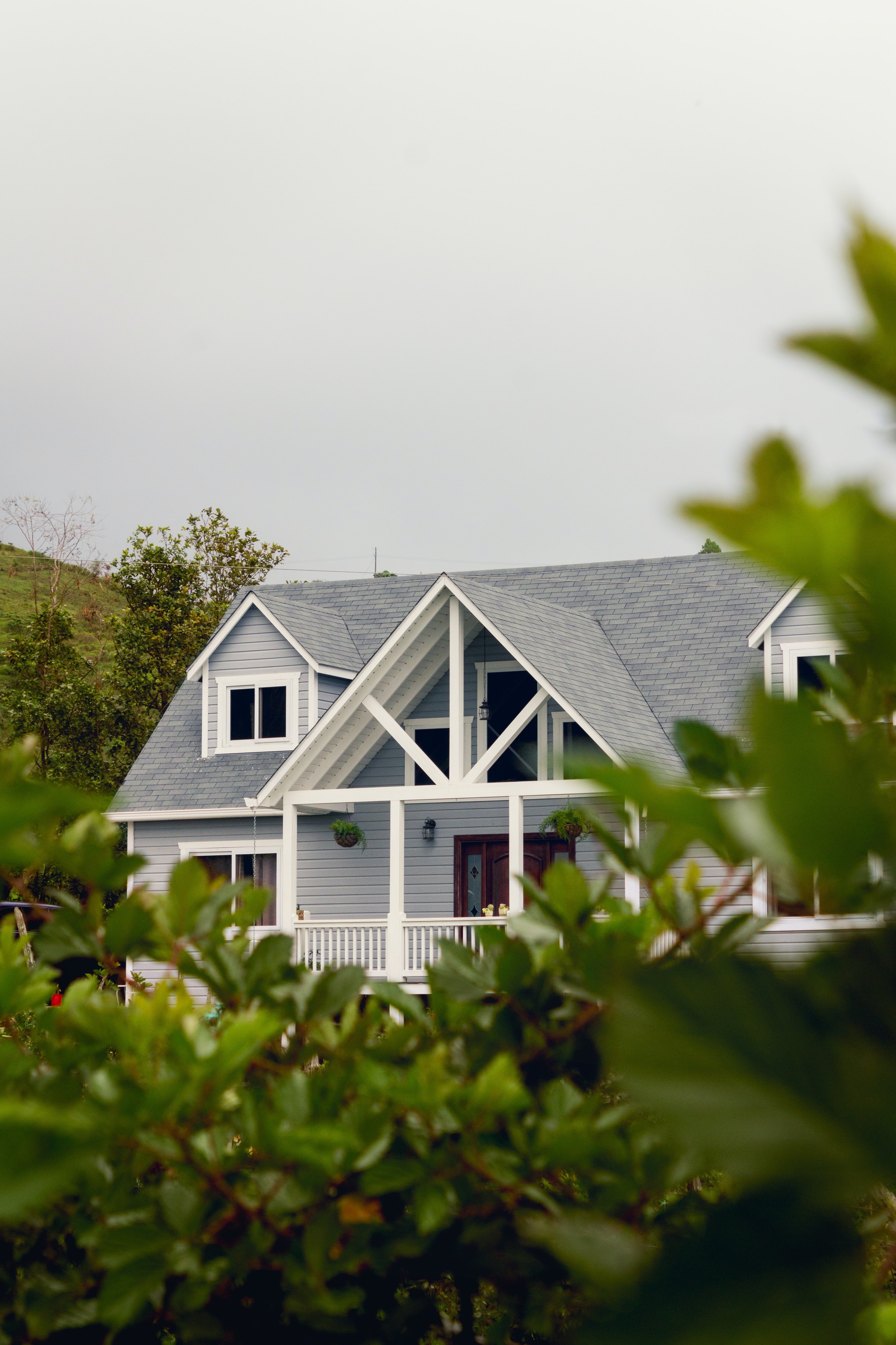 large grey home with shingle roof