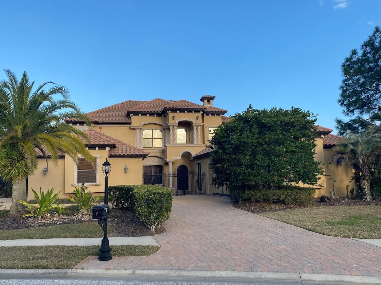 Large home with tile roofing