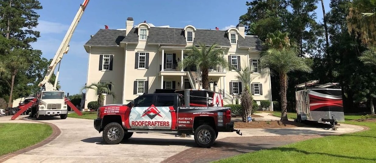 roofcrafters truck in front of home