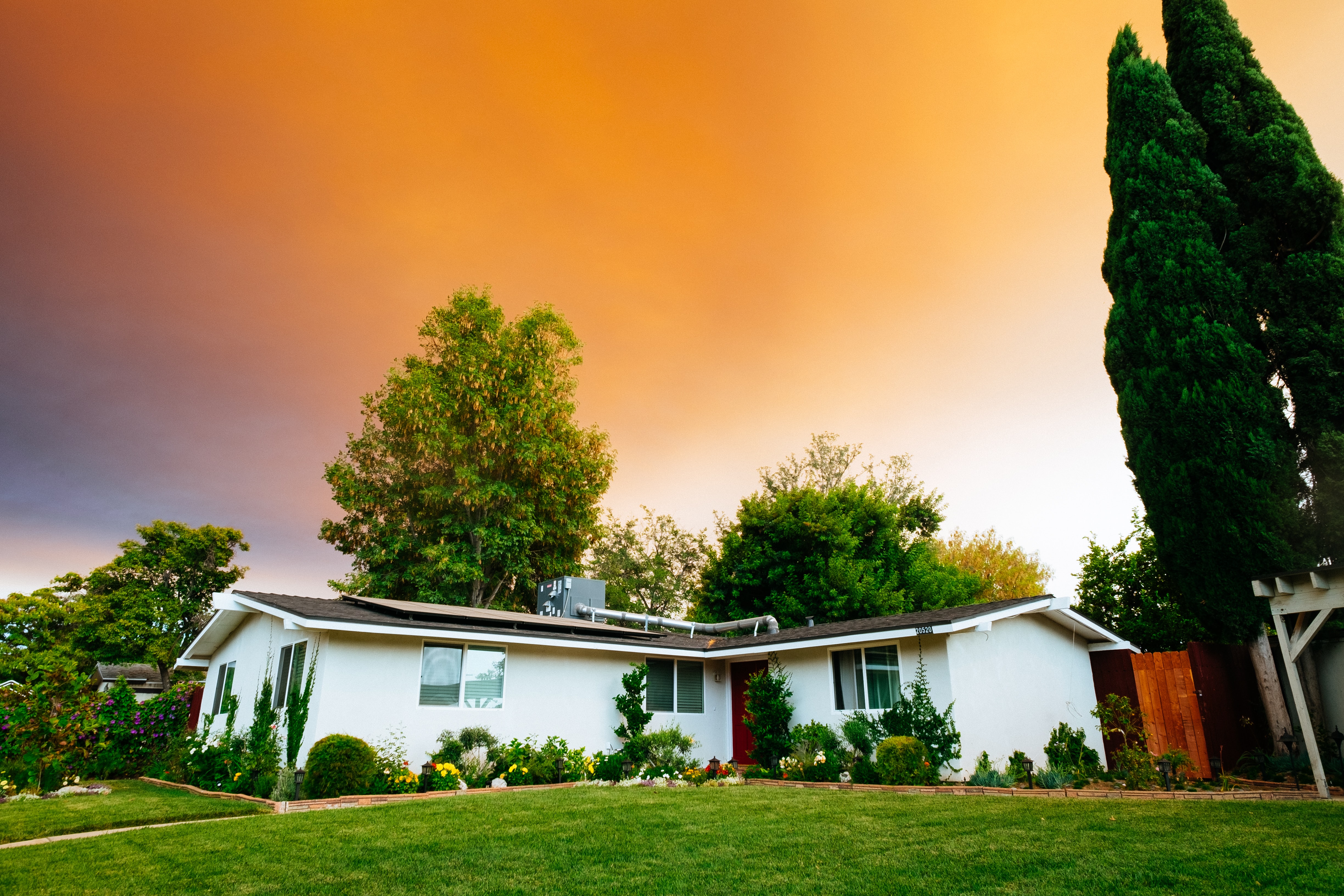 low slope roof home under sunset