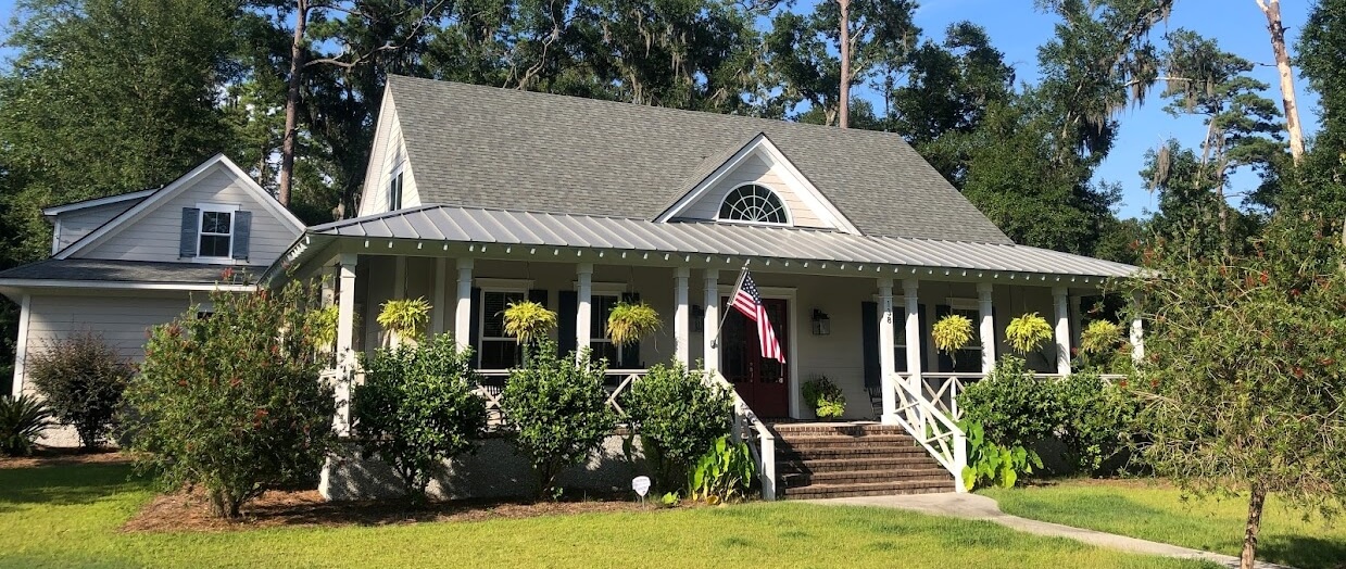 home with both shingles and metal roofing