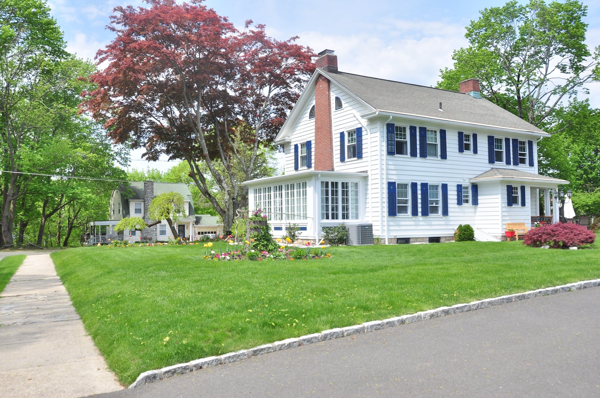 white home with shingle roof