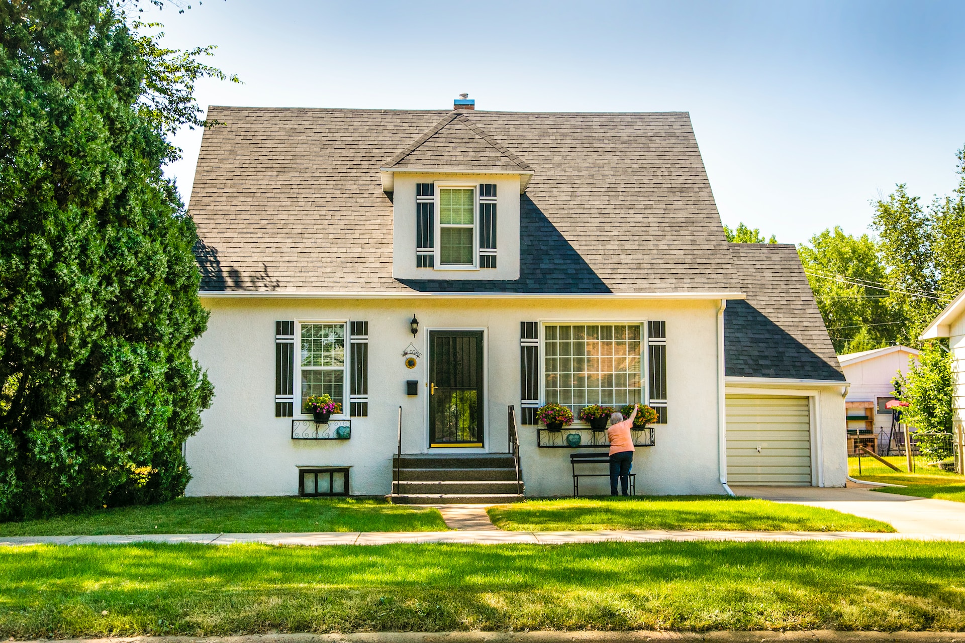 white house with asphalt shingle roof