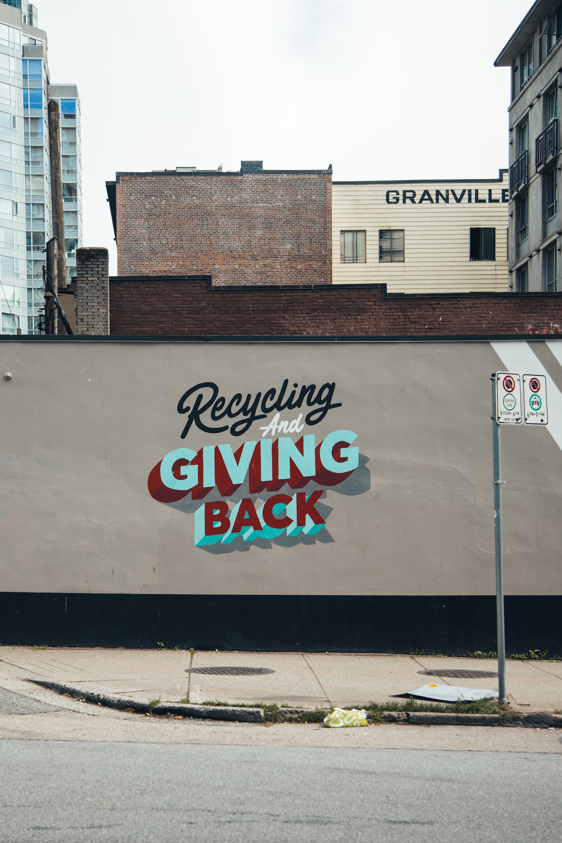 recycling and giving back graphic art on building