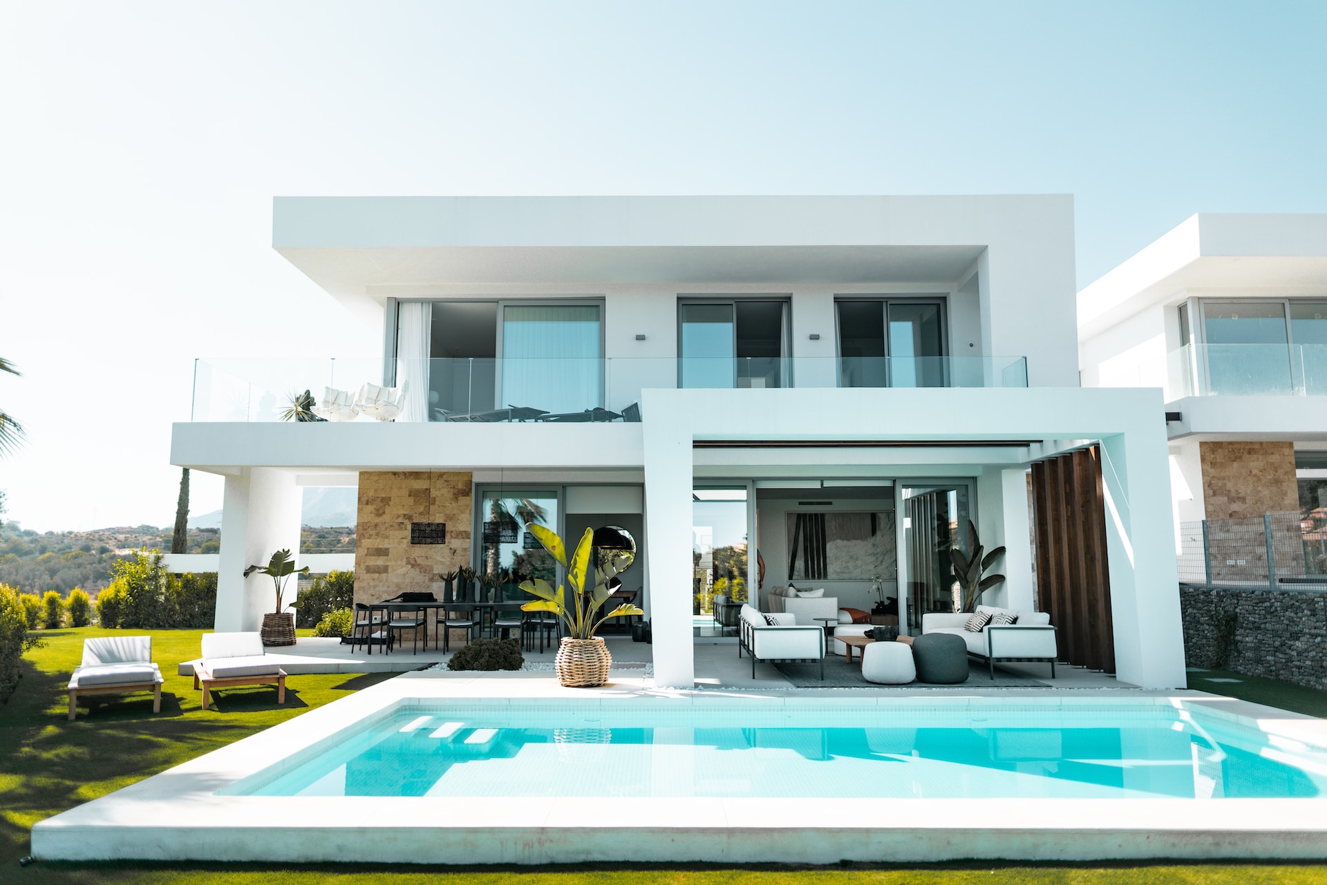 white modern home with backyard pool