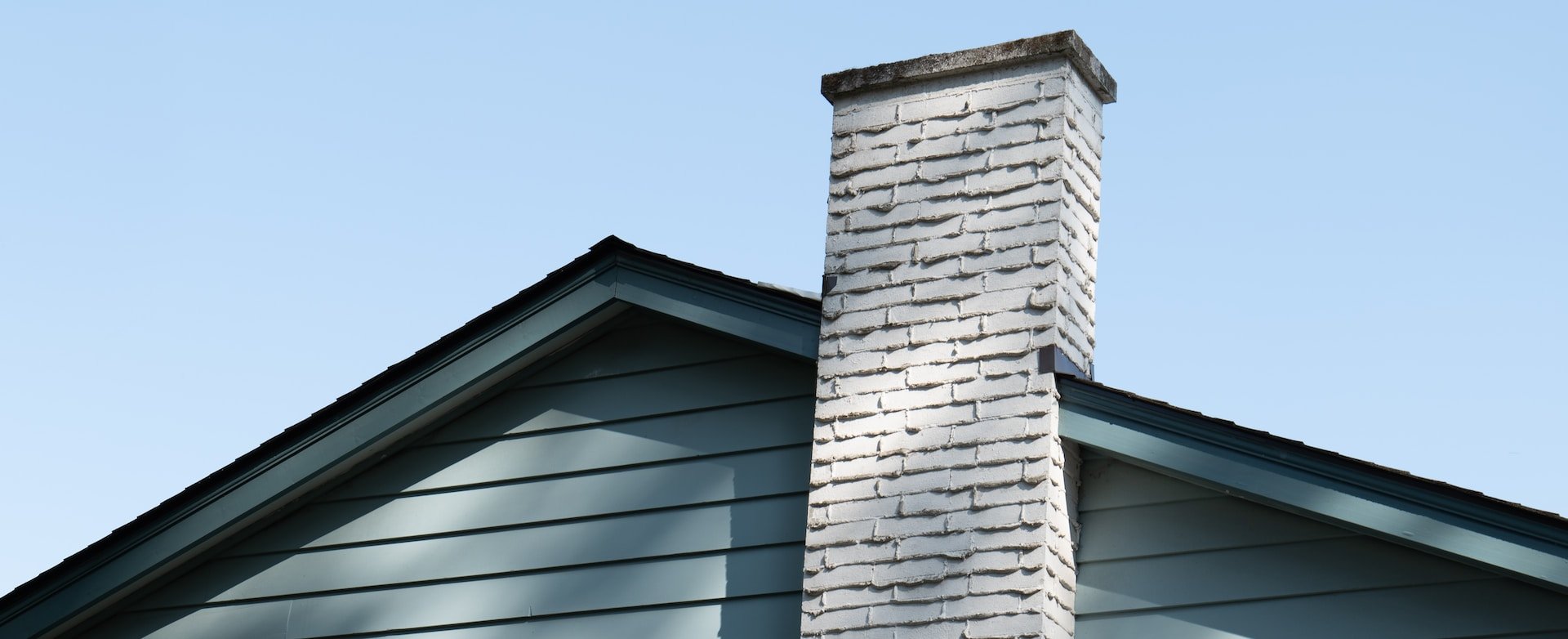 green house with white brick chimney