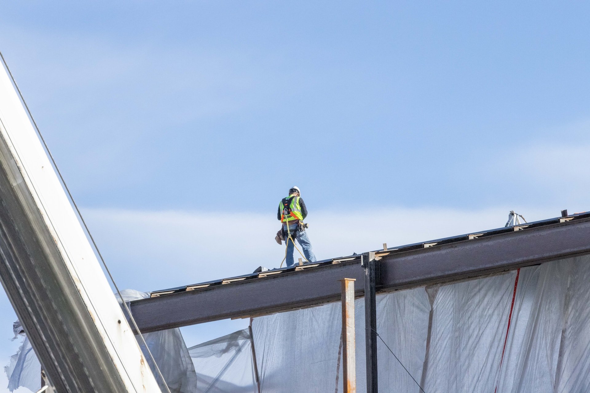 worker standing on roof
