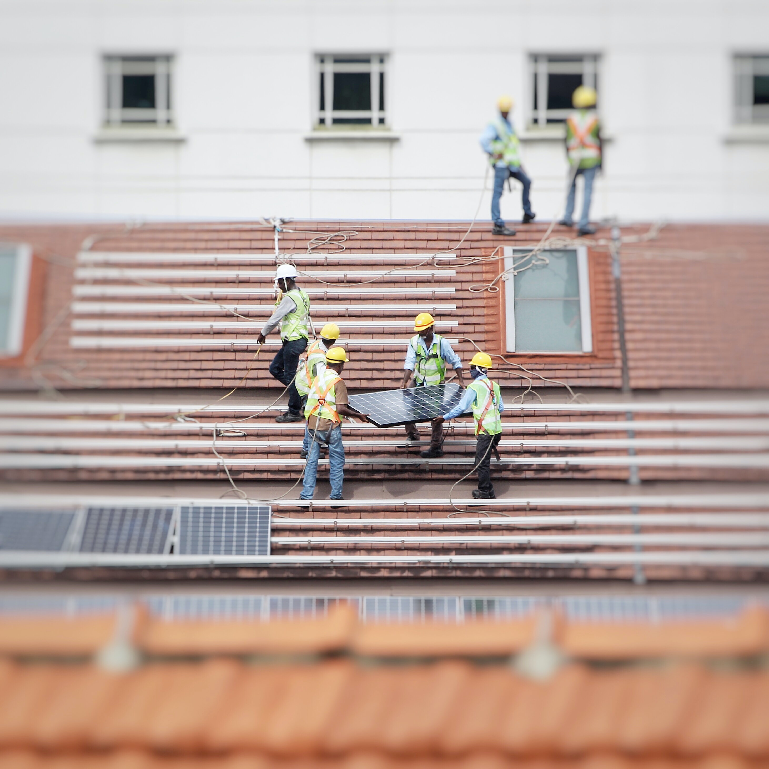 crew installing solar on roof