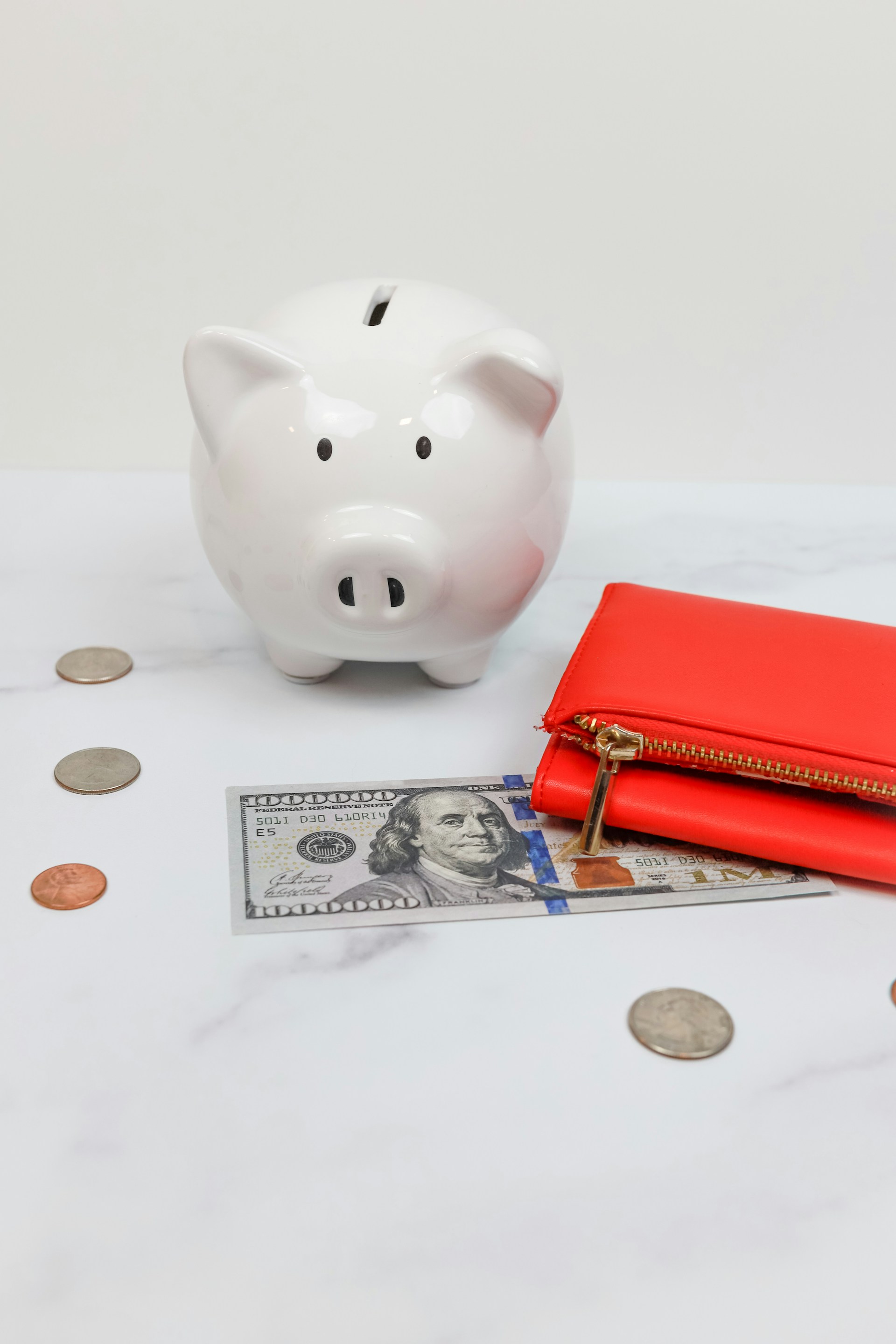 piggy bank with red wallet and money