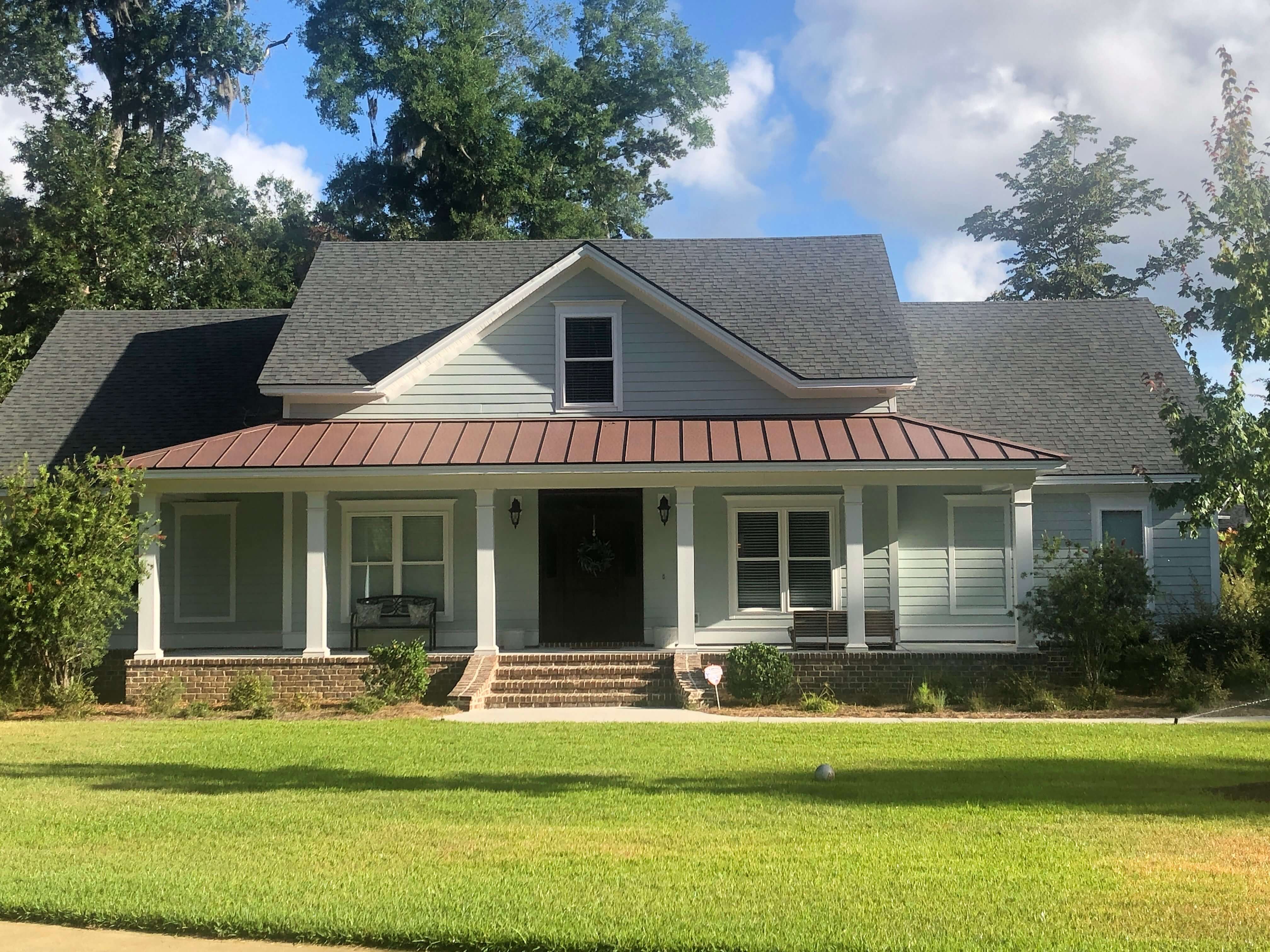 Lowcountry home with a metal accent over front porch