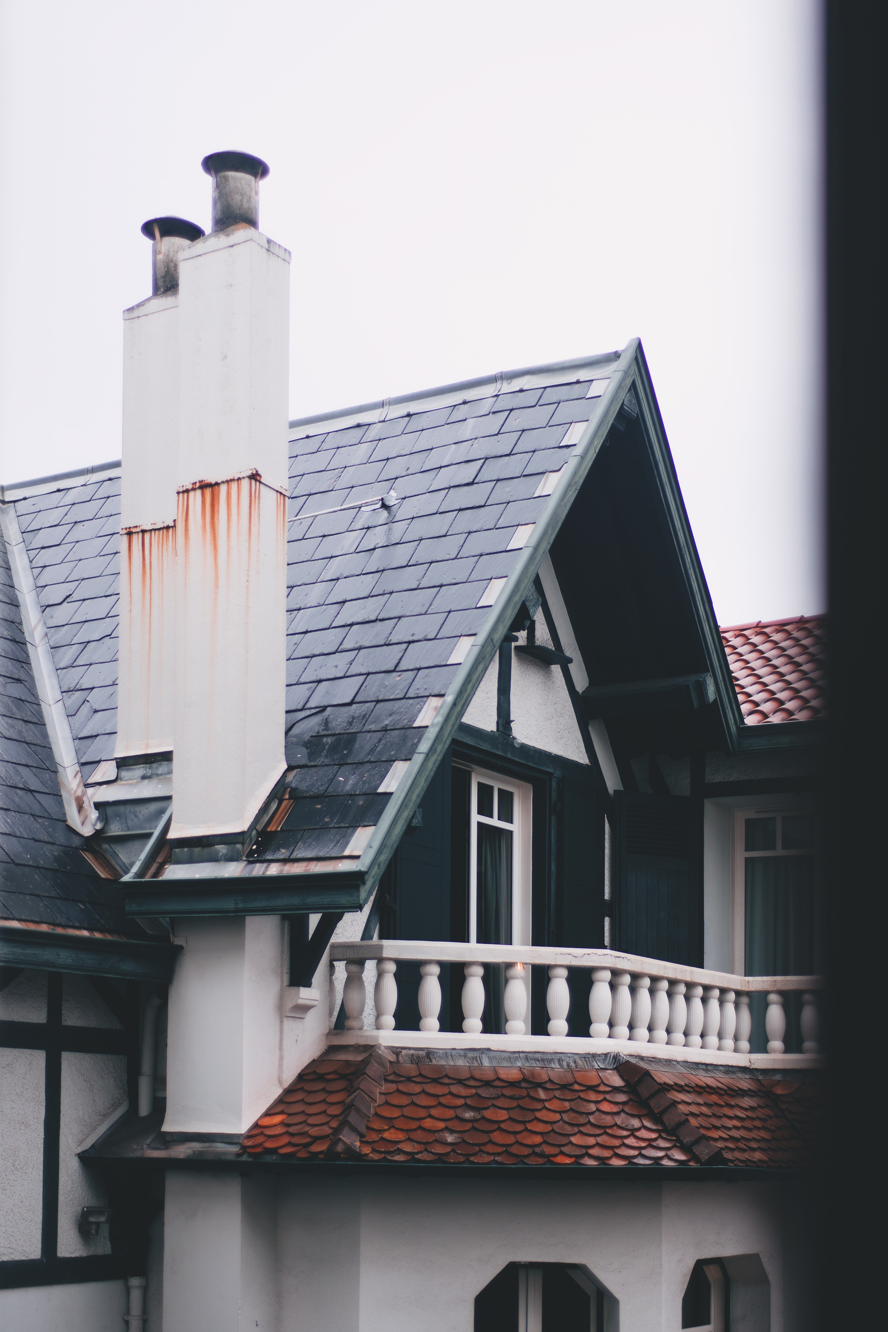 home with damaged chimney and roof