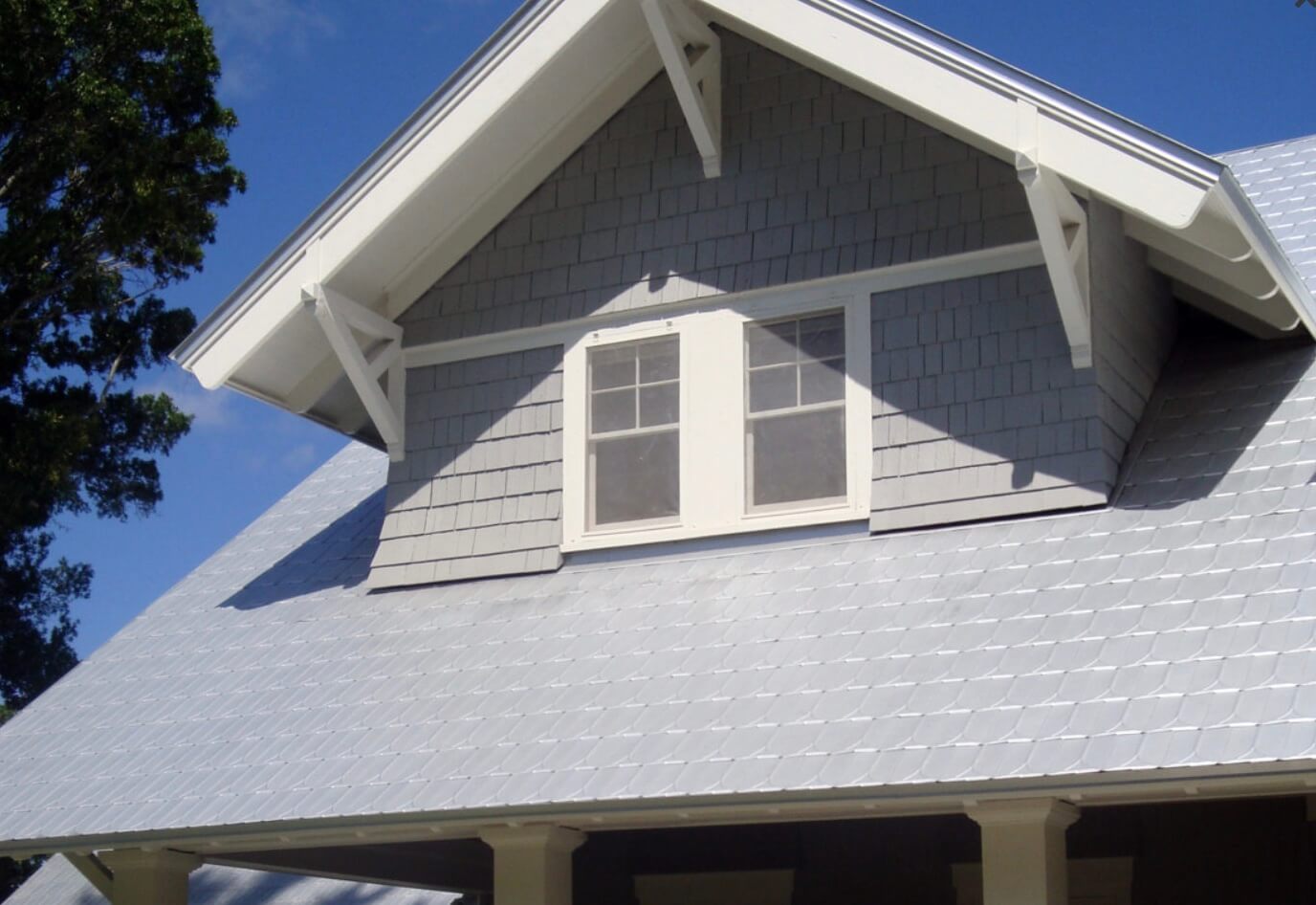 victorian metal shingles on a standard roofline with a gable dormer